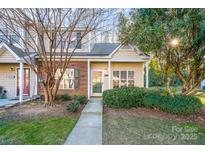 Inviting exterior of charming brick home with well-manicured landscaping at 8146 Rudolph Rd, Charlotte, NC 28216