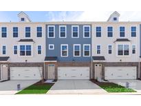 Three-unit townhome building with attached garages and attractive landscaping at 4343 Reed Creek Dr, Sherrills Ford, NC 28673