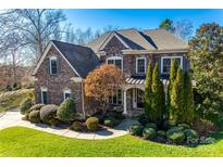 Brick two-story house with landscaped lawn and walkway at 1257 Stacey Ln, Indian Land, SC 29707