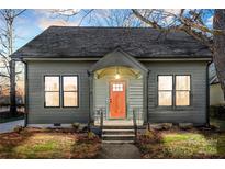 Charming craftsman style home with a freshly painted exterior and updated landscaping at 210 S Millon St, Gastonia, NC 28052