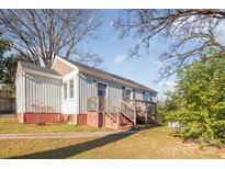 Charming craftsman home with a newly renovated exterior and deck at 2601 Columbus Cir, Charlotte, NC 28208