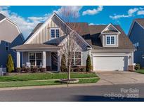 Two-story house with gray siding, a white front door and a two-car garage at 1037 Tobin Dr, Fort Mill, SC 29715