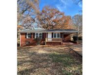 Brick ranch house with new wooden steps and landscaping at 1325 Eastview Ext, Shelby, NC 28152