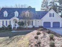 Beautiful two-story home with a two-car garage and well-maintained landscaping at 148 Tetbury Ne Ave, Concord, NC 28025