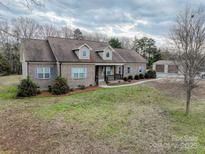 Brick ranch house with attached garage and spacious yard at 2610 Lucy Short Cut Rd, Marshville, NC 28103