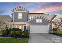 Two-story house with gray siding, white trim, and landscaping at 3126 Elmwood Dr, Monroe, NC 28110