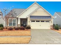 Craftsman style home with two-car garage and landscaped yard at 5021 Redwood Grove Trl # 86, Lancaster, SC 29720