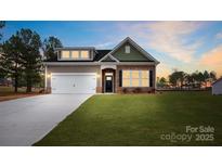 Attractive craftsman style home with a two-car garage and landscaped lawn at 7673 Bainbridge Rd, Sherrills Ford, NC 28673