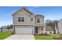 Two-story house with neutral siding, a double garage, and a well-manicured lawn at 111 Mountain Bridge Way, Statesville, NC 28625