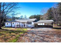 Ranch style home with covered carport and deck at 5020 Foster Rd, Cleveland, NC 27013