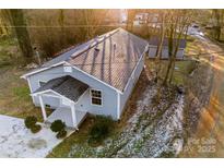 Single story house, gray exterior, in wooded area at 612 Harry St, China Grove, NC 28023