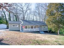 Charming single-story home featuring a welcoming front porch and a well-maintained lawn at 2504 S Cannon Blvd, Kannapolis, NC 28083