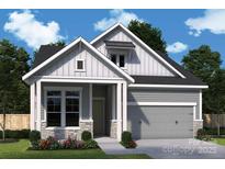 Charming craftsman style home with gray siding and stone accents at 1031 Bourn Ln, Waxhaw, NC 28173