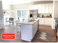 Modern kitchen with island, stainless steel appliances, and granite countertops at 115 Venus Ave, Gastonia, NC 28052
