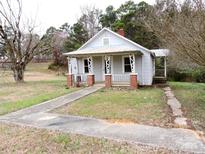Charming one-story house with a front porch and brick accents at 374 Zion Church Rd, Mount Gilead, NC 27306