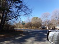 Residential street view with mature trees and homes visible at 5514 Grafton Pl, Charlotte, NC 28212