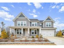 Two-story house with gray siding, stone accents, and a two-car garage at 800 Landau Rd, Waxhaw, NC 28173