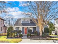 Gray house with red door, landscaping, and a driveway at 716 Ideal Way, Charlotte, NC 28203