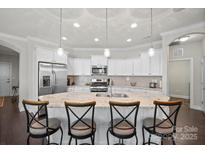 Modern kitchen with stainless steel appliances and an island at 9113 Meadowmist Ln, Huntersville, NC 28078