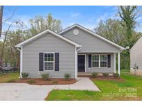 Newly constructed gray house with black shutters and a small front yard at 939 Stonewall S Ave, Rock Hill, SC 29730