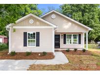 Charming single story home with beige siding, black shutters, and a well-maintained front yard at 939 Stonewall S Ave, Rock Hill, SC 29730
