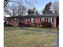 Brick ranch home with landscaped yard and walkway at 2918 Imperial Dr, Gastonia, NC 28054