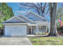 Charming two-story home with gray siding, white trim, and a two-car garage at 3123 Windsor Dr, Charlotte, NC 28209