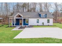 Charming blue and white home with a covered porch, stone walkway, and well-manicured lawn at 108 Robinson Dr, Cherryville, NC 28021