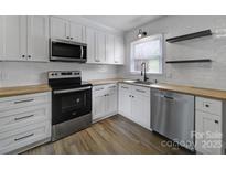 Modern kitchen featuring stainless steel appliances and light wood countertops at 438 Stoneycreek Ln, Rock Hill, SC 29730