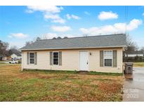Ranch style home with vinyl siding and a spacious yard at 506 Misenheimer St, Rockwell, NC 28138