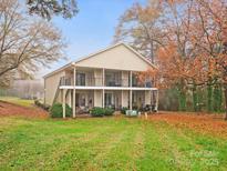 Charming home with a two-story porch overlooking a spacious backyard at 1985 Lancer Ct, Gastonia, NC 28054