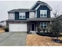 Two-story house with gray and blue siding, stone accents, and a two-car garage at 2031 Killian Creek Dr, Denver, NC 28037