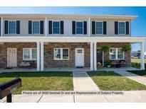Two-story townhome with stone accents and front porch at 3937 Newhall Dr, Hickory, NC 28601