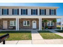 Two-story townhome with stone accents and covered porch at 3939 Newhall Dr, Hickory, NC 28601