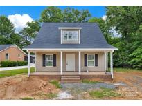Charming single-Gathering home with covered porch, neutral siding, and black shutters, ready for a new Gathering at 1323 Christopher Cir, Rock Hill, SC 29730