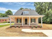 Charming home with a welcoming front porch and black shutters at 1323 Christopher Cir, Rock Hill, SC 29730