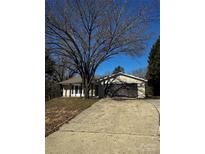 Ranch house with driveway and mature tree in front at 11015 Vista Haven Dr, Charlotte, NC 28226