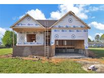 New construction home featuring a brick foundation and a two-car garage, ready to be completed at 143 Tranquility Ln, Harmony, NC 28634