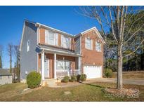 Brick and gray two-story house with a double garage at 105 Fleishhacker Pl, Mooresville, NC 28117