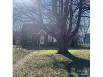 Brick house with a tree in front and a walkway at 815 E Lafayette St, Salisbury, NC 28144