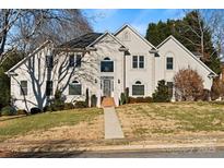 Stately two-story home with a manicured front lawn and elegant architectural details on a sunny day at 430 43Rd Nw Ave, Hickory, NC 28601