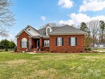 Brick home with a large front yard and mature trees at 5928 Newell Dr, Monroe, NC 28112