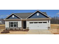 Charming single-story home features a white garage door, complementary paint colors, and manicured landscaping at 150 Adams Tree Way, Troutman, NC 28166