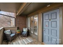 Charming outdoor patio with cushioned seating and a view, perfect for relaxing and unwinding at 421 N Church St # 12F, Charlotte, NC 28202