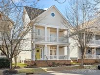 Two-story home with charming facade and front porch at 10114 Tolleson Ave, Charlotte, NC 28277