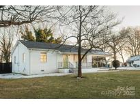 Charming ranch home with a spacious yard and covered porch at 3069 W Main St, Claremont, NC 28610