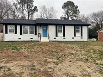 Charming ranch home with updated exterior and landscaping at 7519 Marlbrook Dr, Charlotte, NC 28212