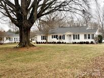 Charming ranch home with large yard and mature tree at 9915 Washam Potts Rd, Cornelius, NC 28031