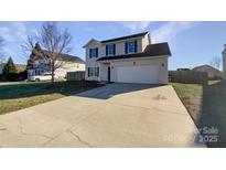 Two-story house with attached garage and front yard at 113 Boiling Brook Dr, Statesville, NC 28625