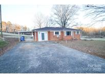 Brick ranch house with carport and large yard at 1308 Mckay Rd, Newton, NC 28658